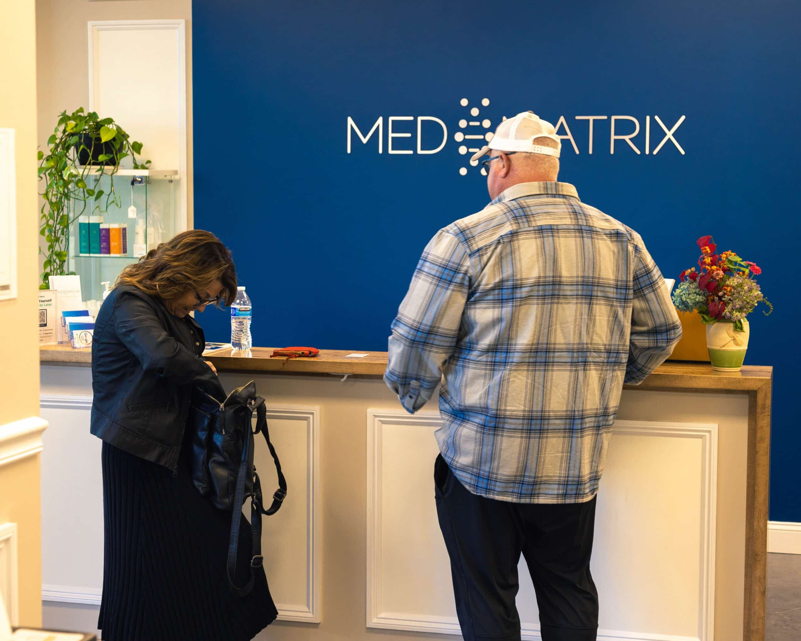 Patients checking in at the Med Matrix front desk