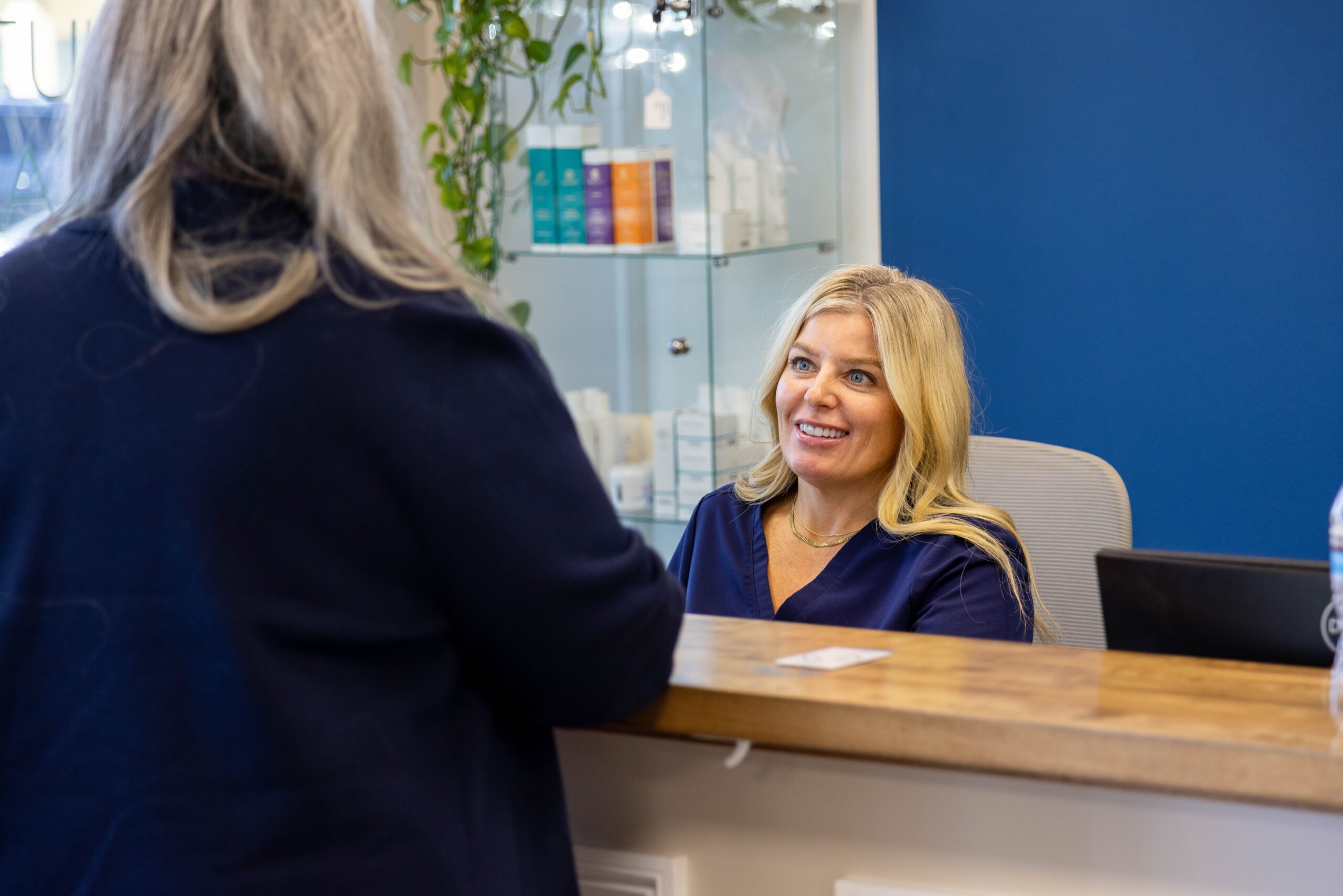 happy client and staff at med matrix functional medicine office in south portland maine